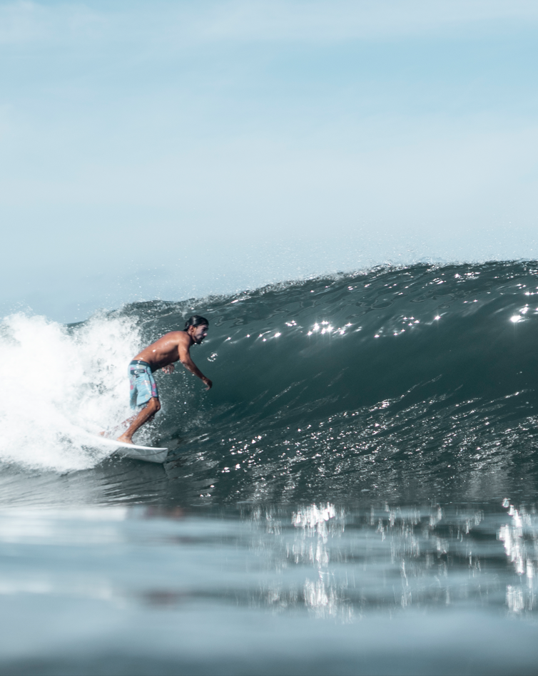Surfer getting barreled in a wave